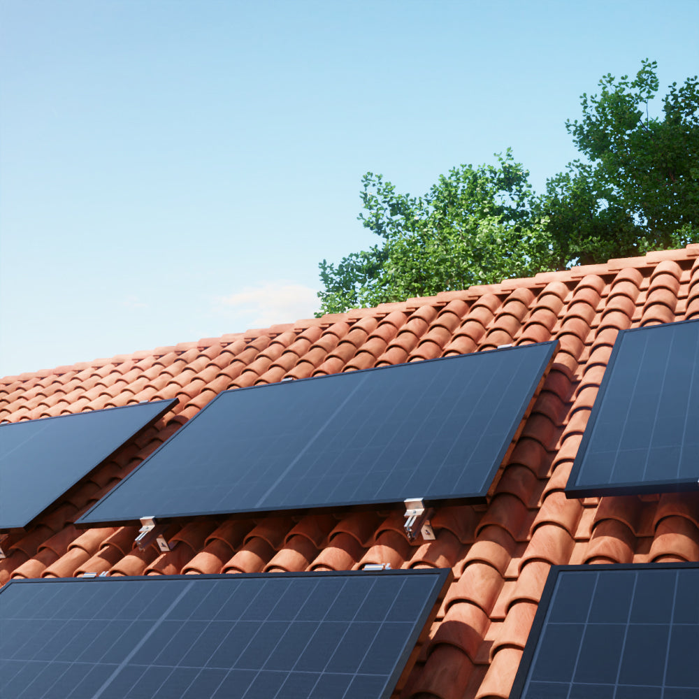 Solar panels installed on a terracotta tile roof – Paneles solares instalados en un tejado de tejas de terracota