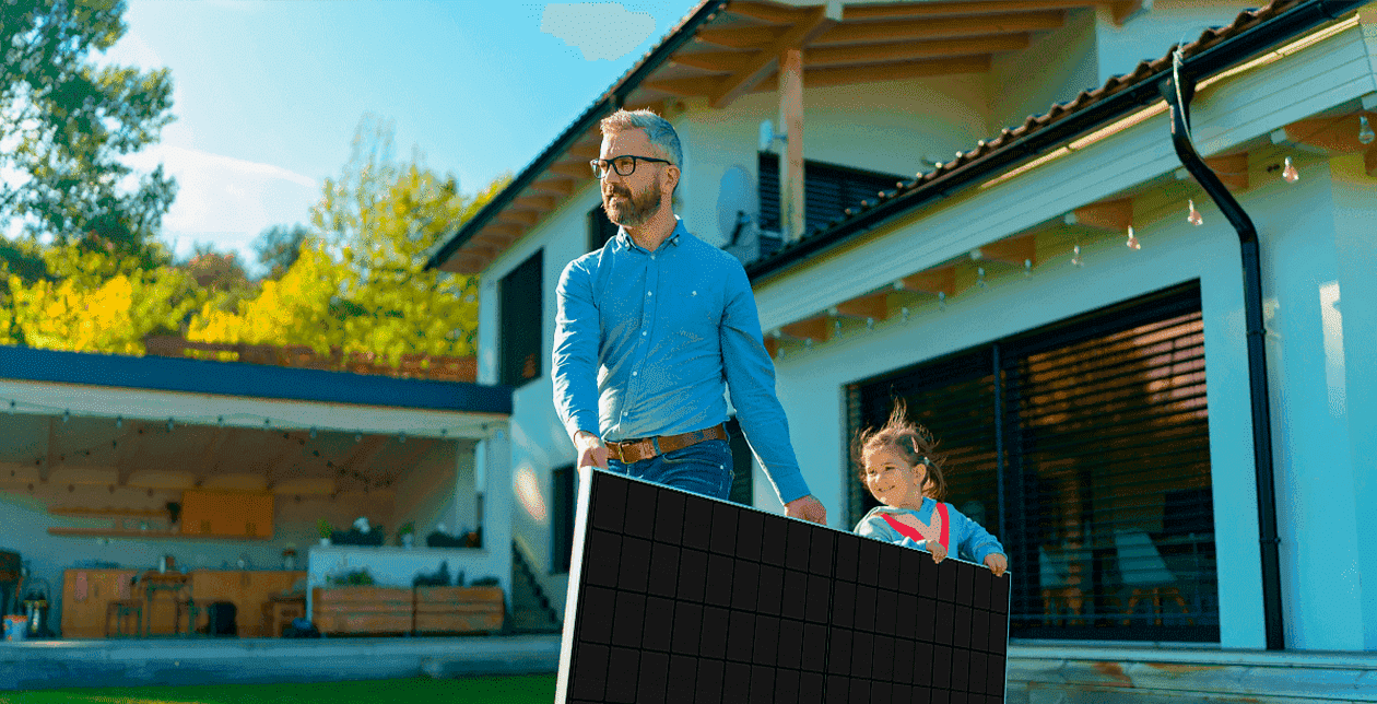 Happy family carrying a solar panel