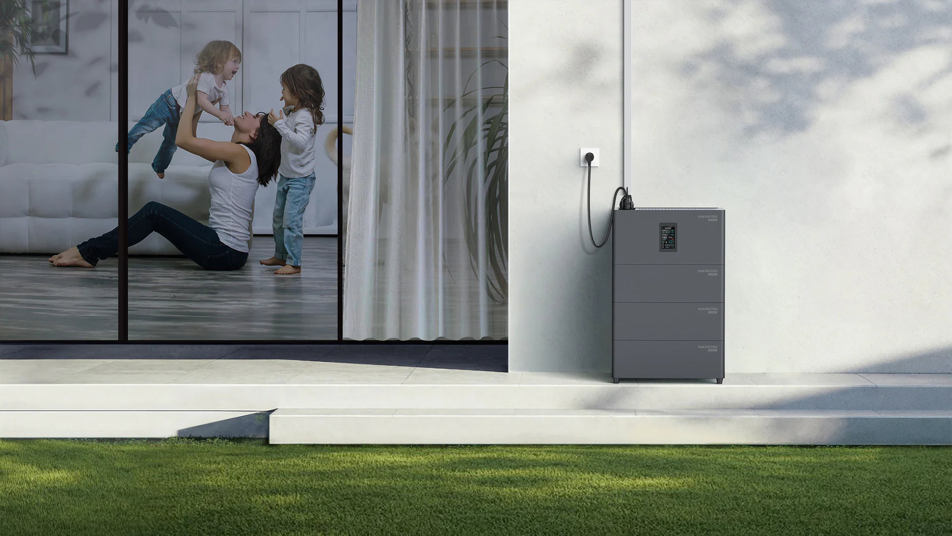 Wall-mounted all-in-one solar battery next to a glass door with a mother and child playing inside